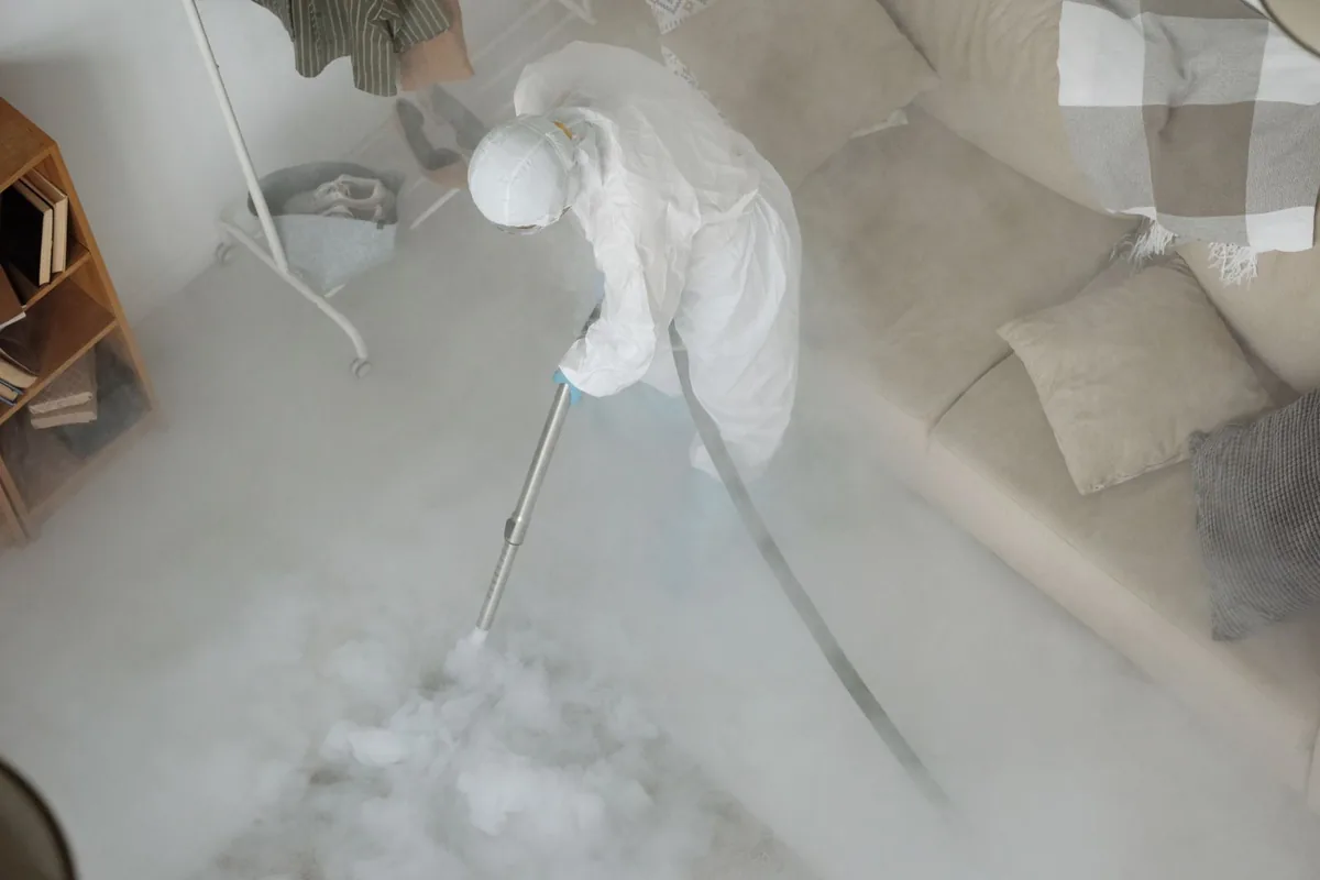 Biohazard cleanup technician in protective equipment, Brewerton, NY